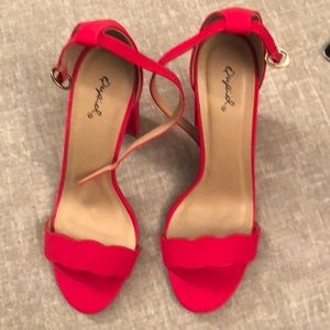 Red scalloped high heels